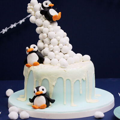 Frosty Winter Penguin Cake With Sprinkles And Presents
