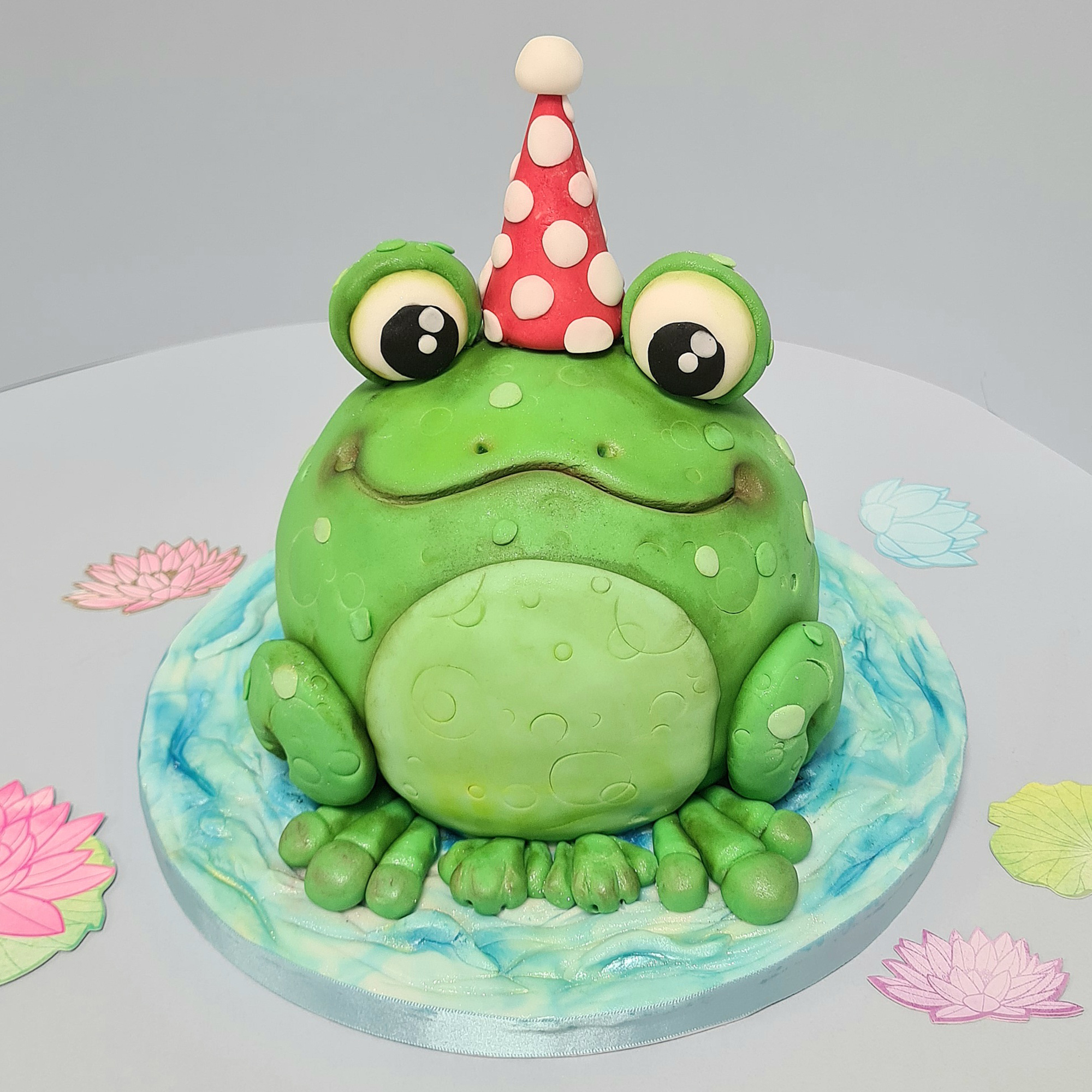 Premium AI Image | There is a cake with a frog on top of it generative ai