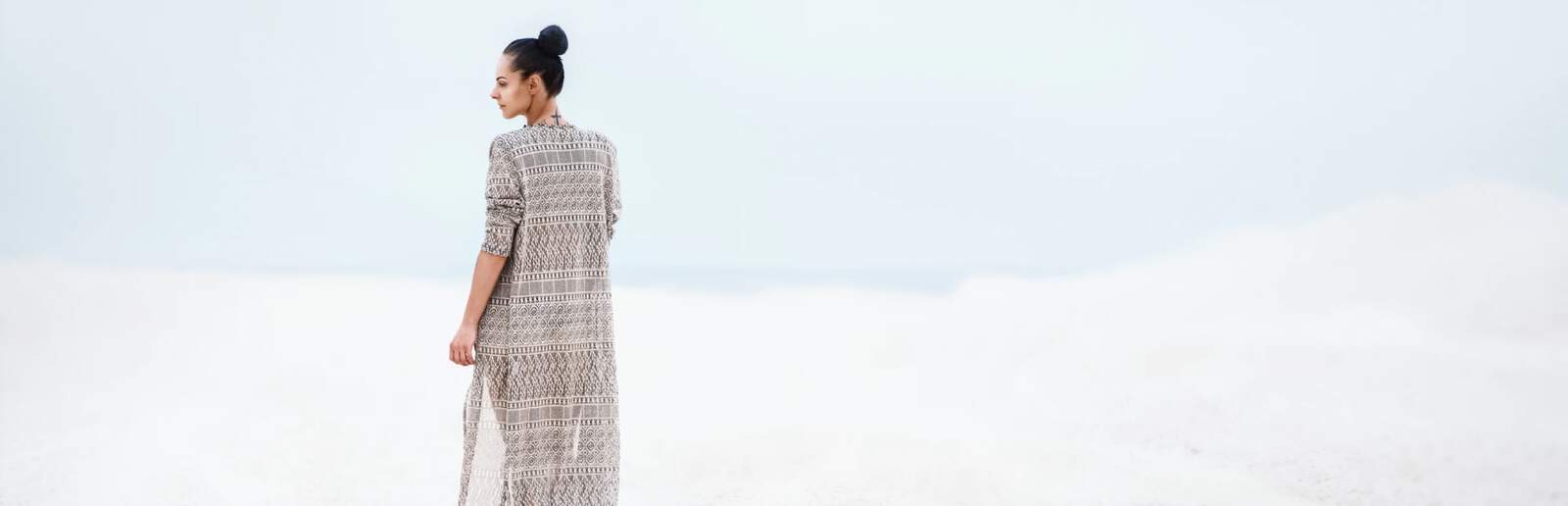 Girl stand on the beach.